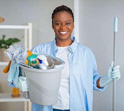 smiling best value cleaning employee ready to provide event cleaning service